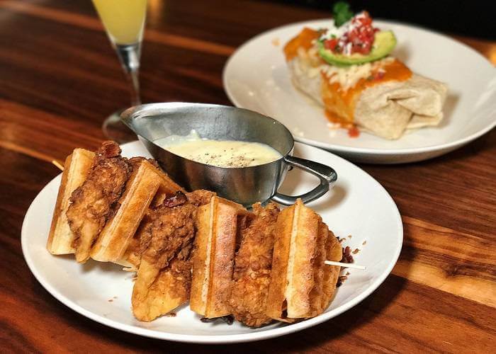 Where You Should be “Brunch-ing” in Laguna Beach Nicks Laguna Beach Fried Chicken Waffle Breakfast Burrito Mimosa